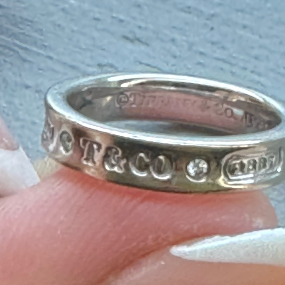 Tiffany & co silver band with two small diamond inlay